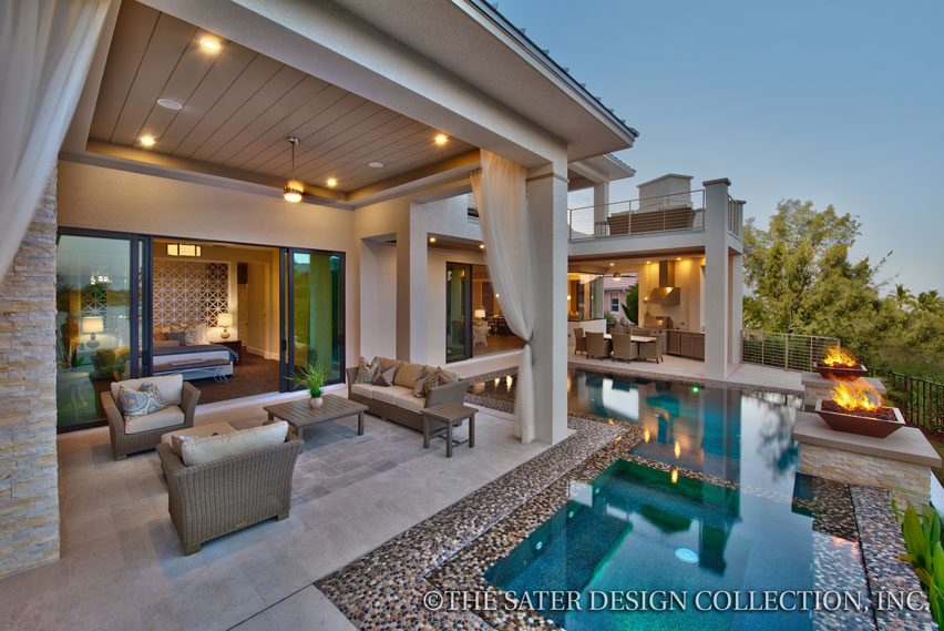 Infinity edge swimming pool sits between the solana nd the outdoor kitchen.