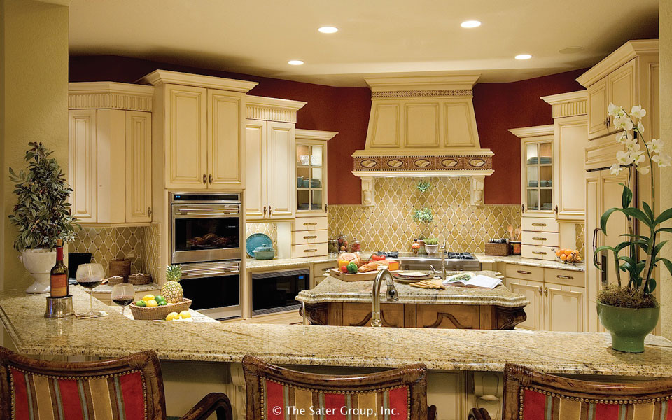 The kitchen has a central island and a long curved serving bar.