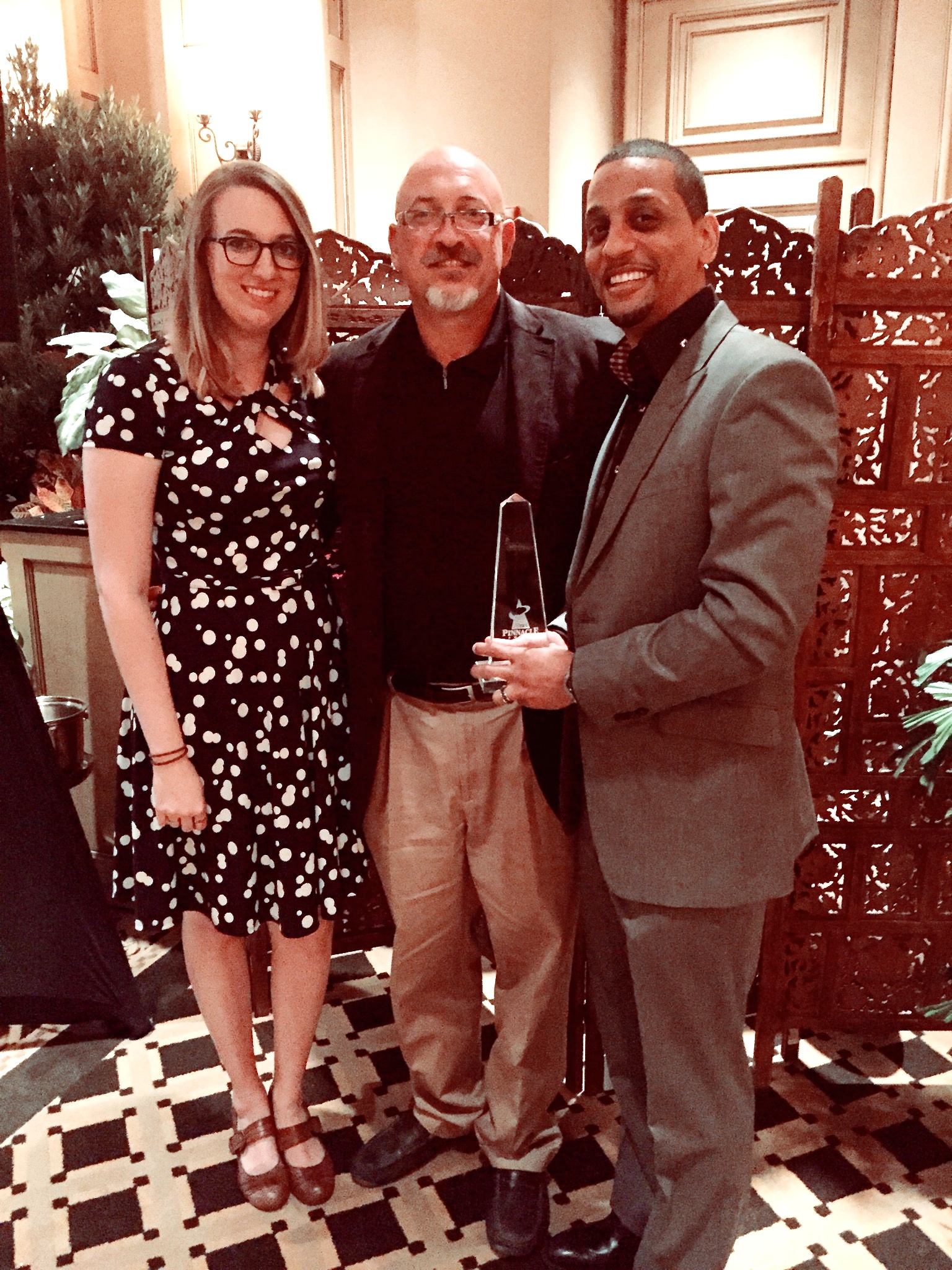 Danielle, Dan and Ben with the Pinnacle Award