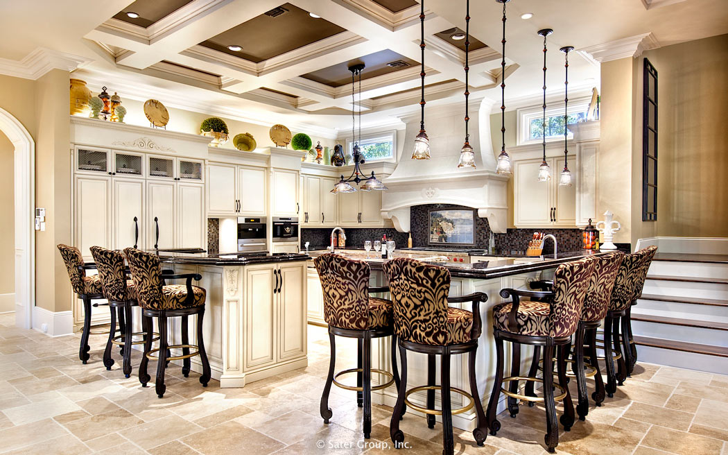 The kitchen features a tray ceiling and large center island.