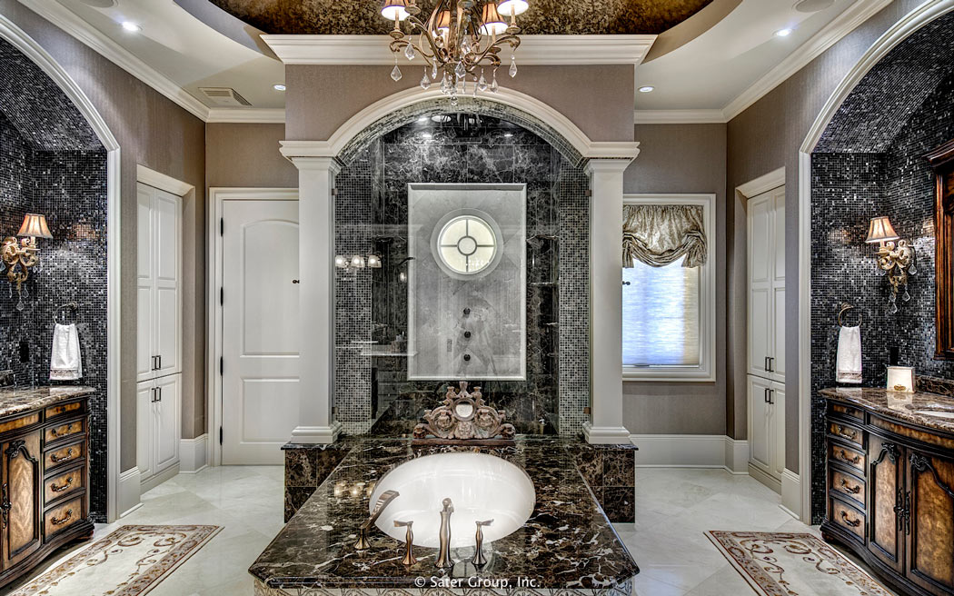 The master suite bathroom features a large soaking tub.